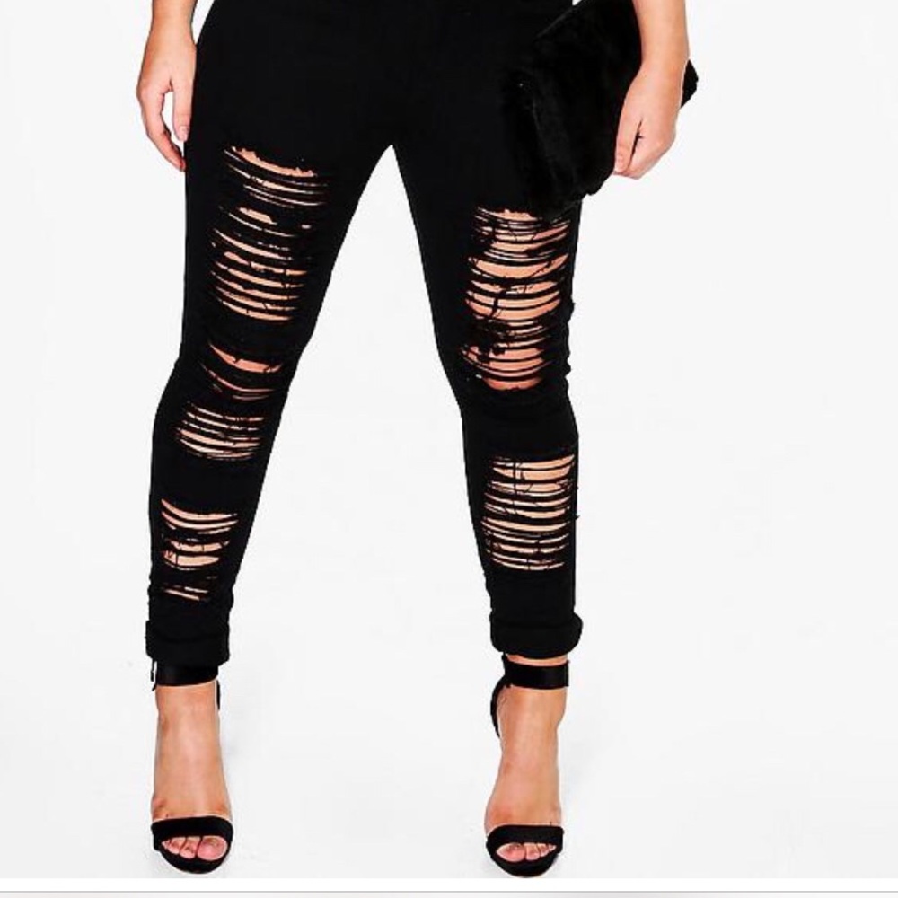 Distressed black skinny jeans
